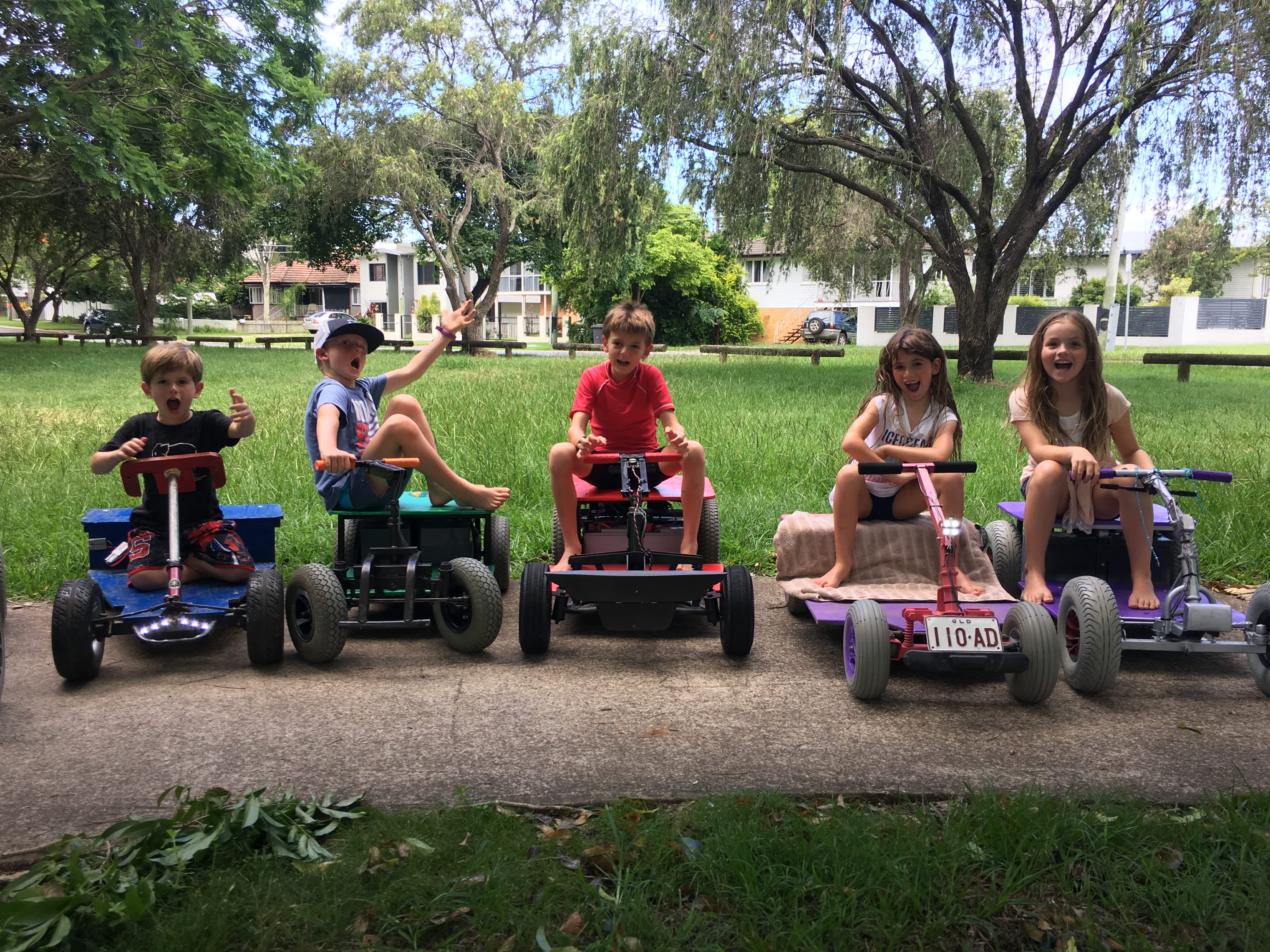 Five children on their electric cars